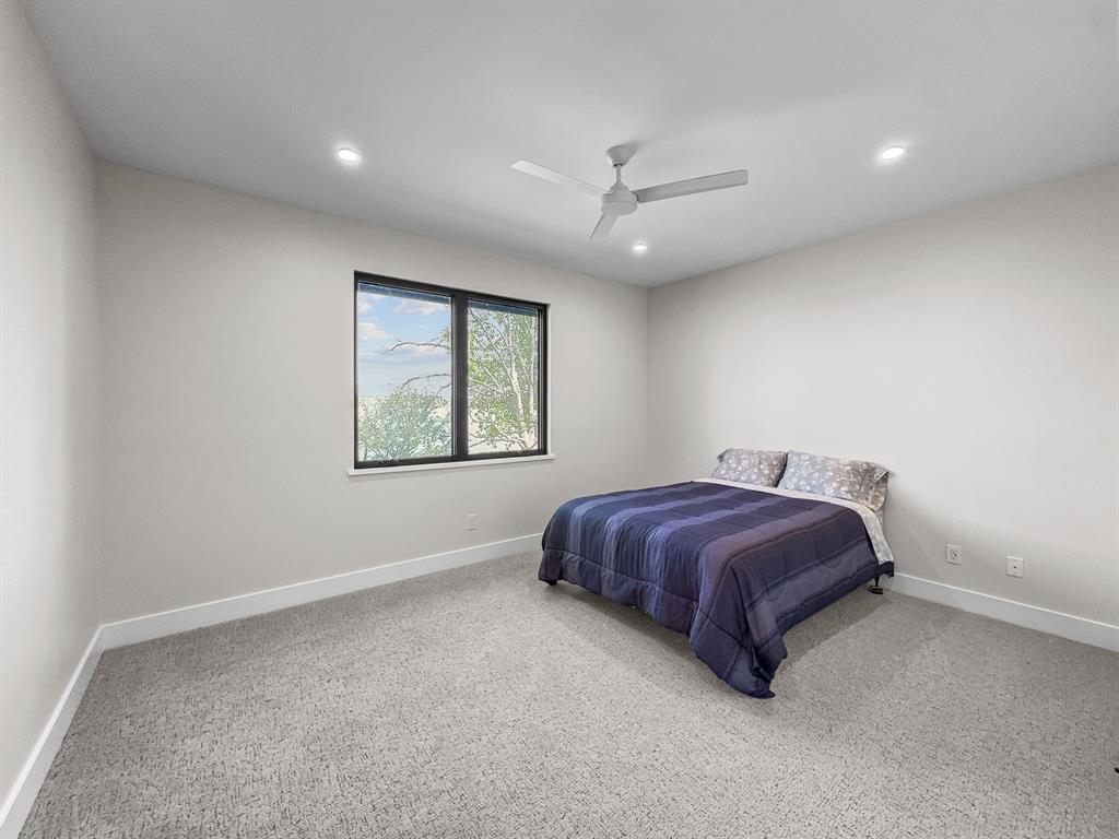 1163 Willow Road Graford, TX 76449 - Photo 19 of 31 a spacious bedroom with a bed and a window