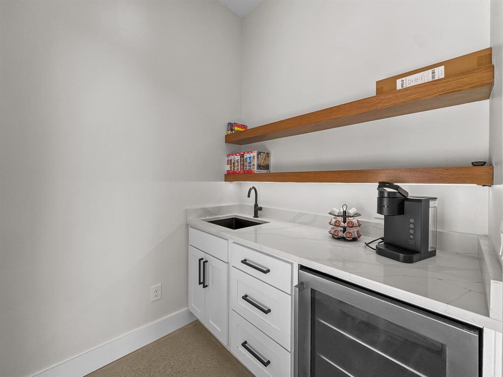 1163 Willow Road Graford, TX 76449 - Photo 21 of 31 a kitchen with sink and white cabinets