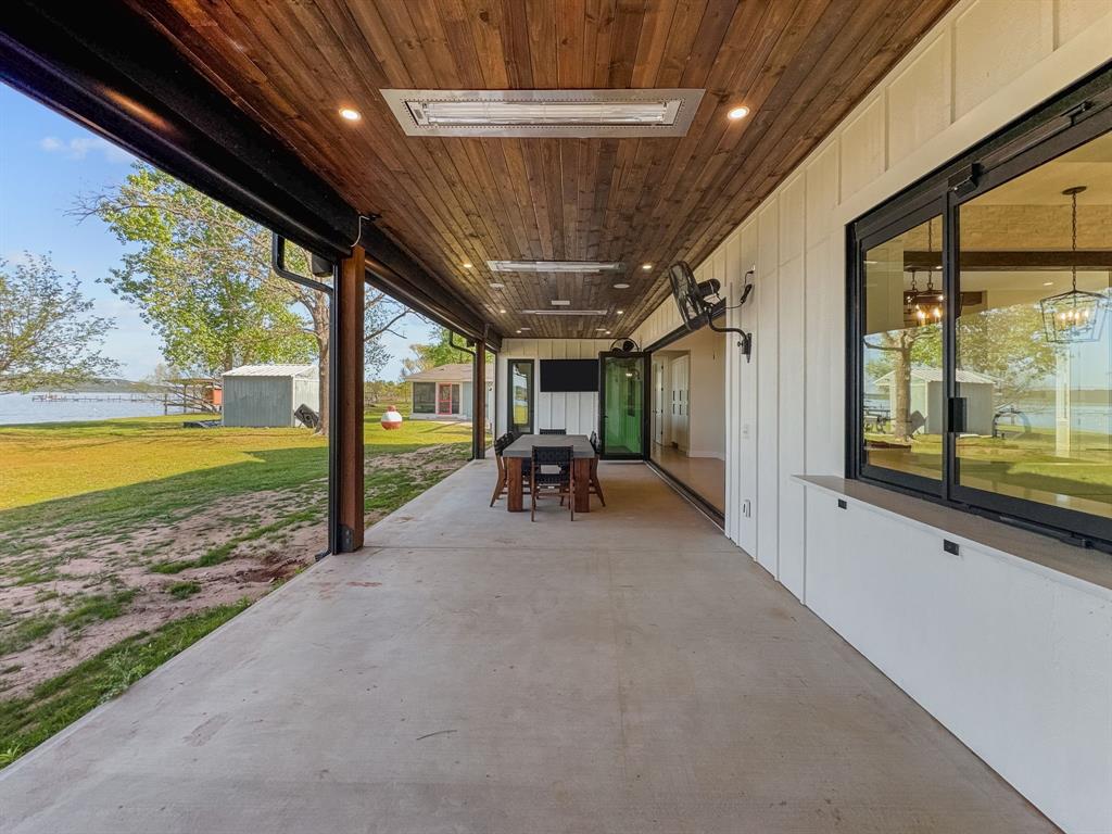 1163 Willow Road Graford, TX 76449 - Photo 27 of 31 a view of a livingroom with furniture and floor to ceiling window
