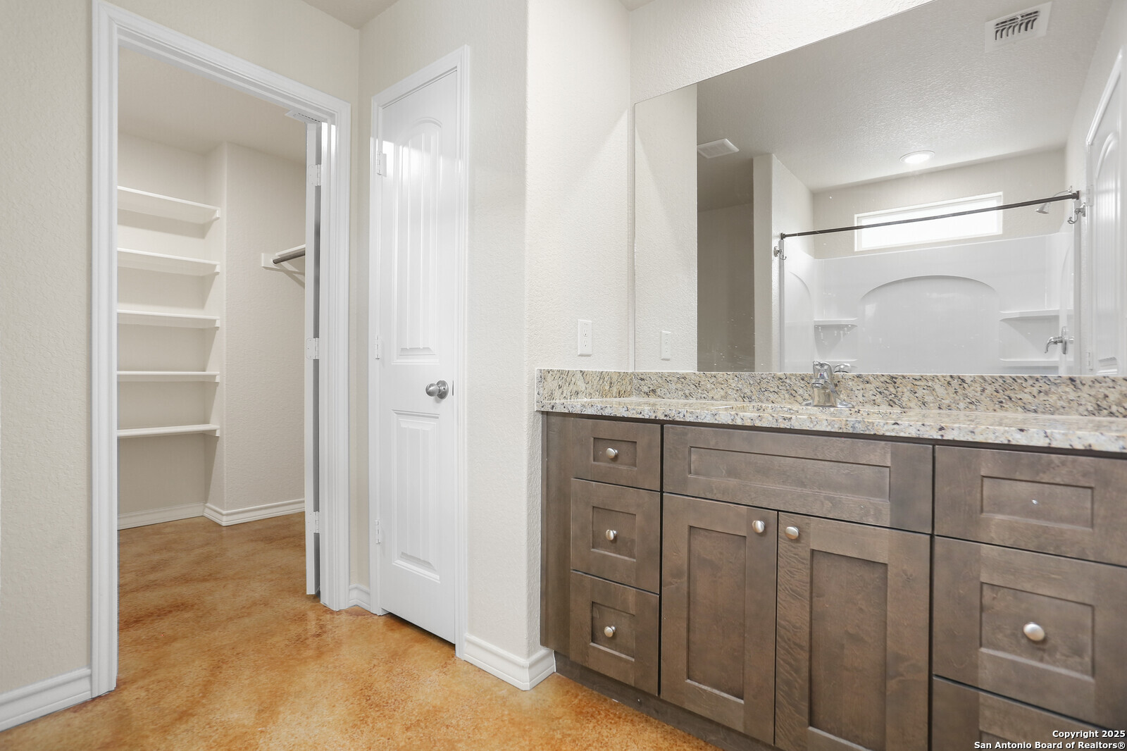 150 Hill Drive Spring Branch, TX 78070 - Photo 12 of 21 a bathroom with a granite countertop sink and a mirror