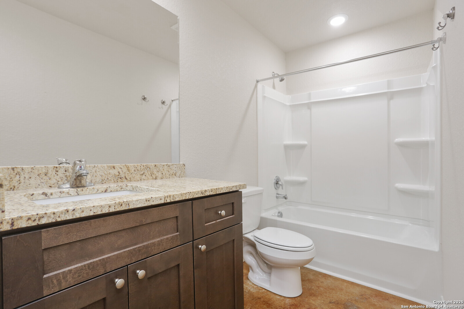 150 Hill Drive Spring Branch, TX 78070 - Photo 14 of 21 a bathroom with a granite countertop sink toilet a shower and a bathtub