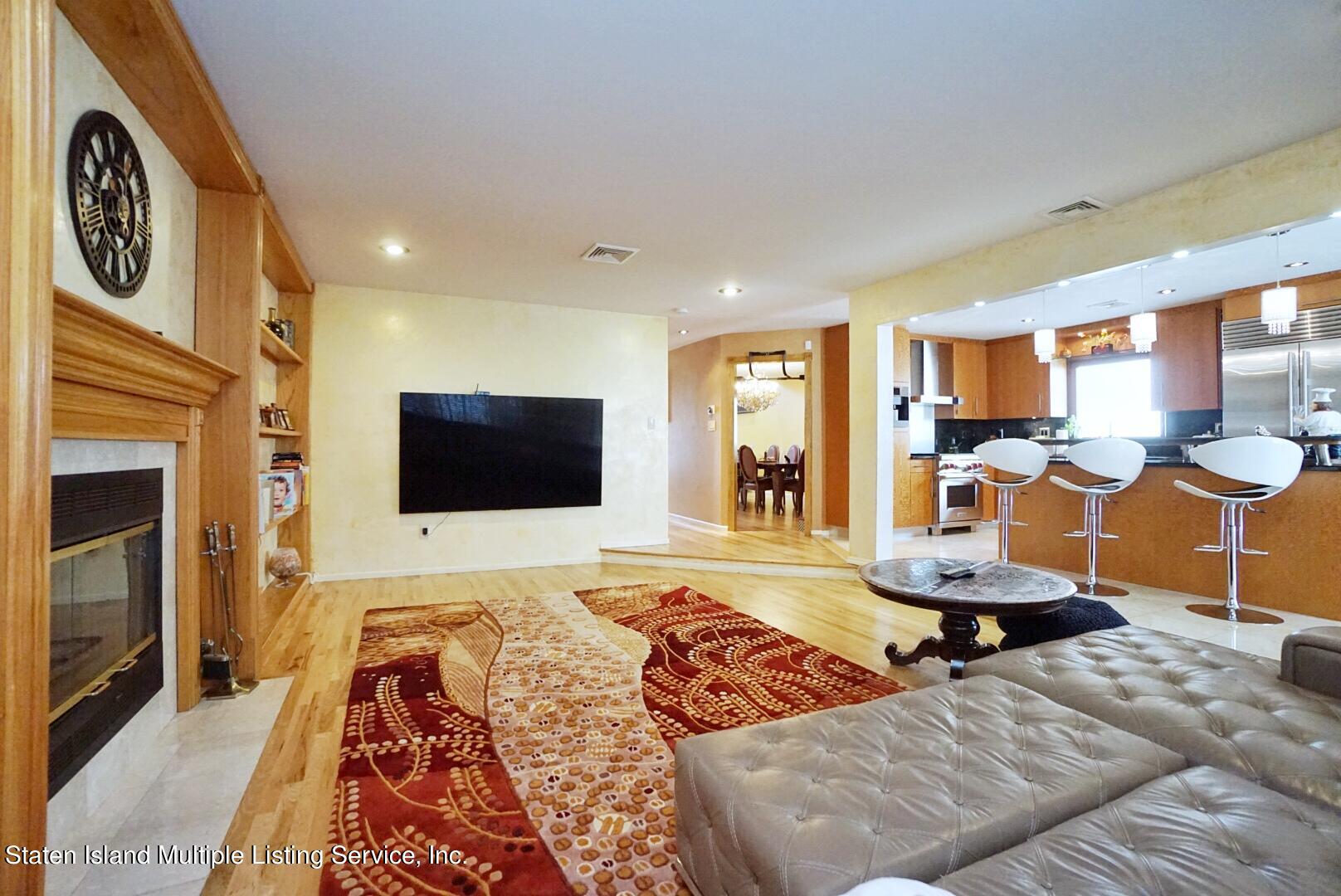 67 Covington Circle Staten Island, NY 10312 - Photo 13 of 45 a bedroom with furniture and a flat screen tv