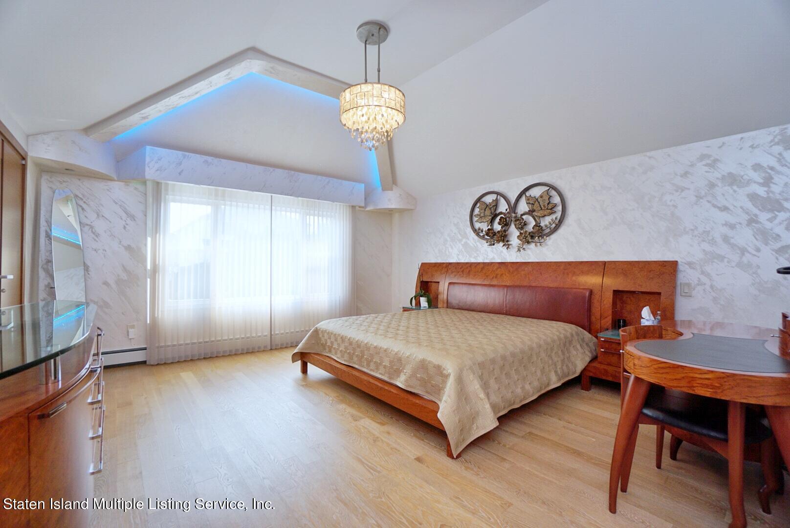 67 Covington Circle Staten Island, NY 10312 - Photo 22 of 45 a bedroom with a bed and a table
