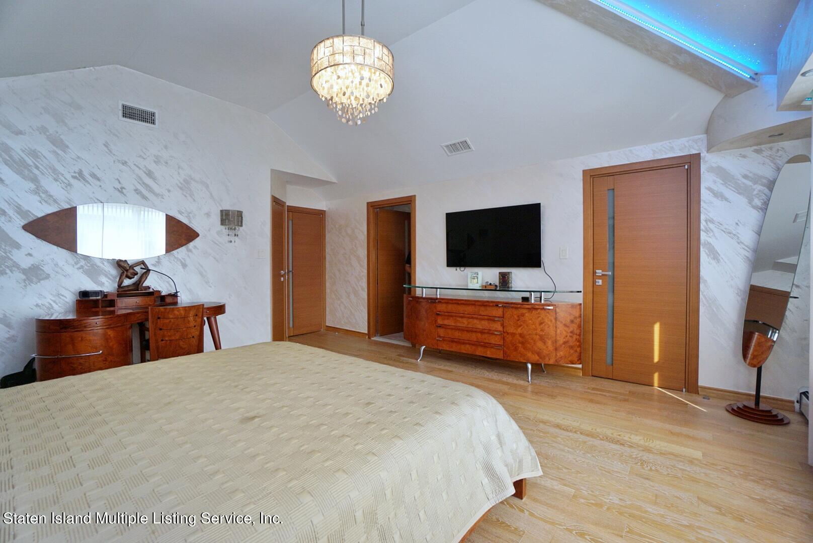 67 Covington Circle Staten Island, NY 10312 - Photo 24 of 45 a bedroom with bed and tv