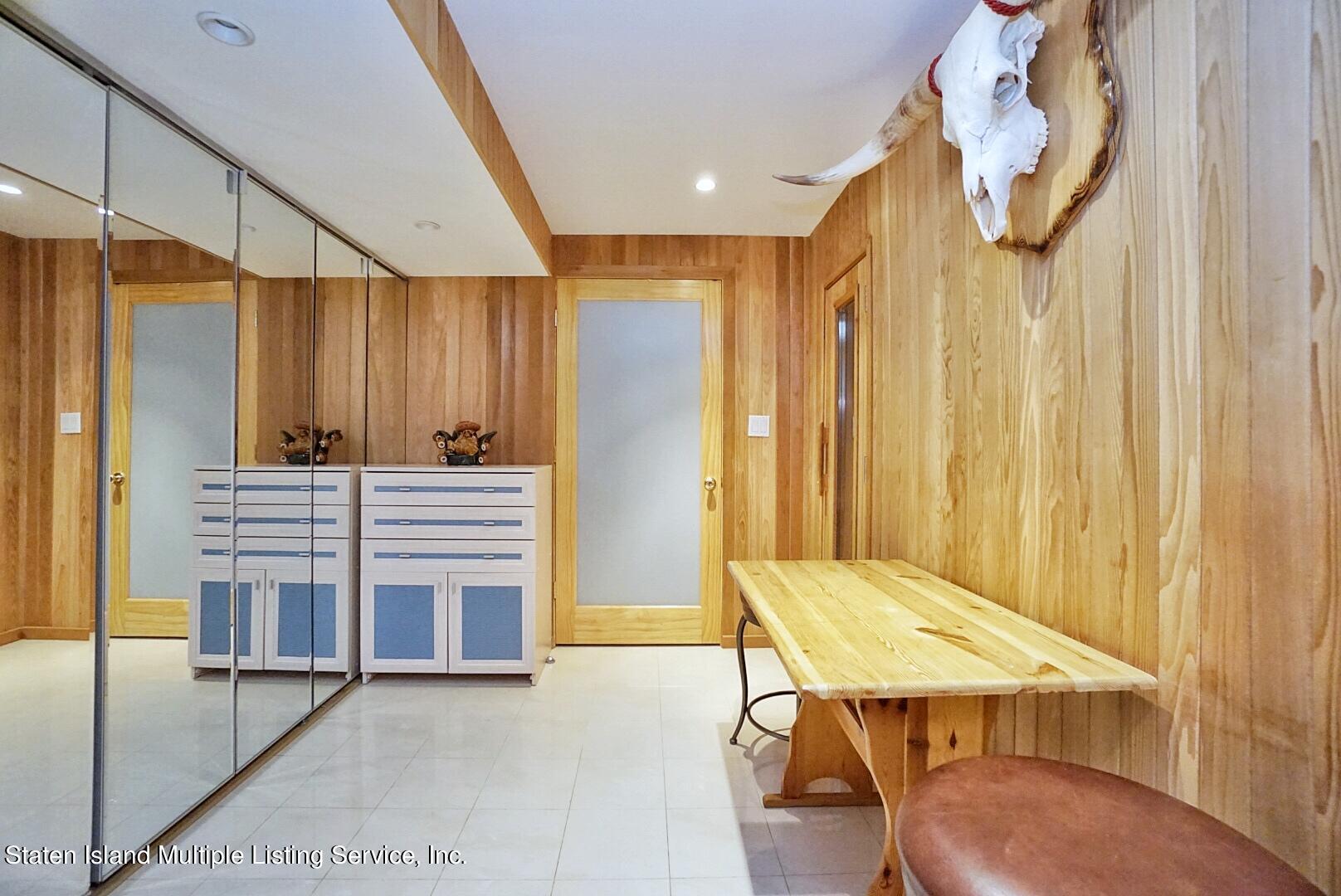 67 Covington Circle Staten Island, NY 10312 - Photo 38 of 45 a view of a hallway with entryway door front of the house