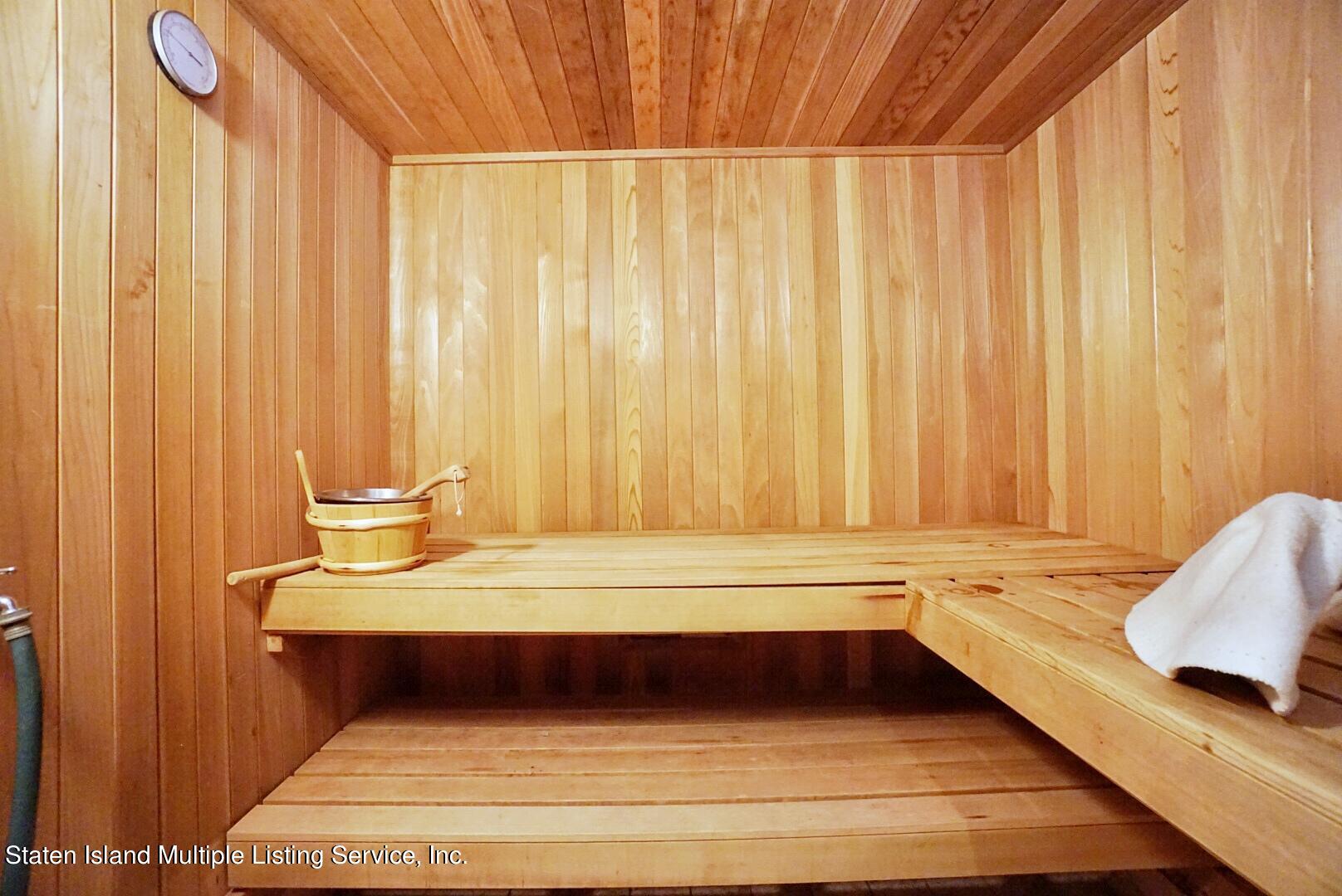 67 Covington Circle Staten Island, NY 10312 - Photo 39 of 45 a bathroom with a bathtub and a window