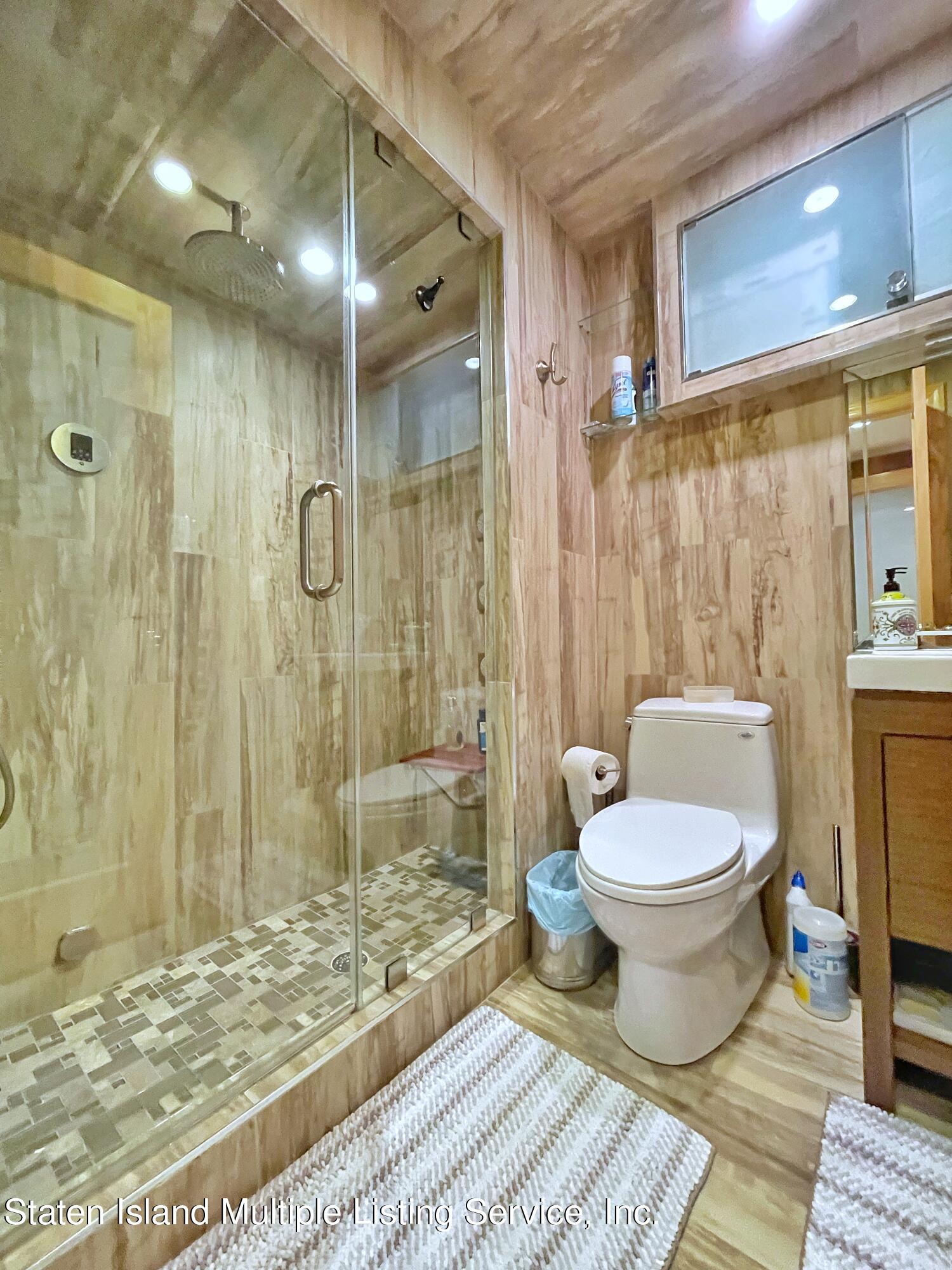 67 Covington Circle Staten Island, NY 10312 - Photo 40 of 45 a bathroom with a toilet shower and a sink