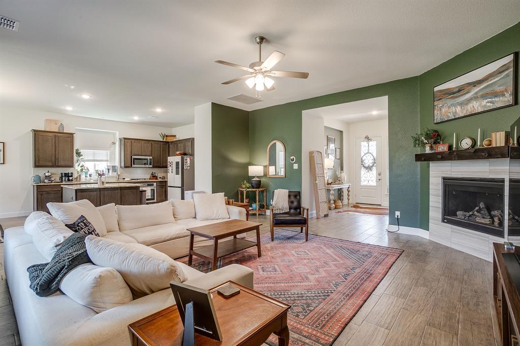 3929 Brookdale Road Benbrook, TX 76116 - Photo 11 of 39 a living room with furniture and a fireplace