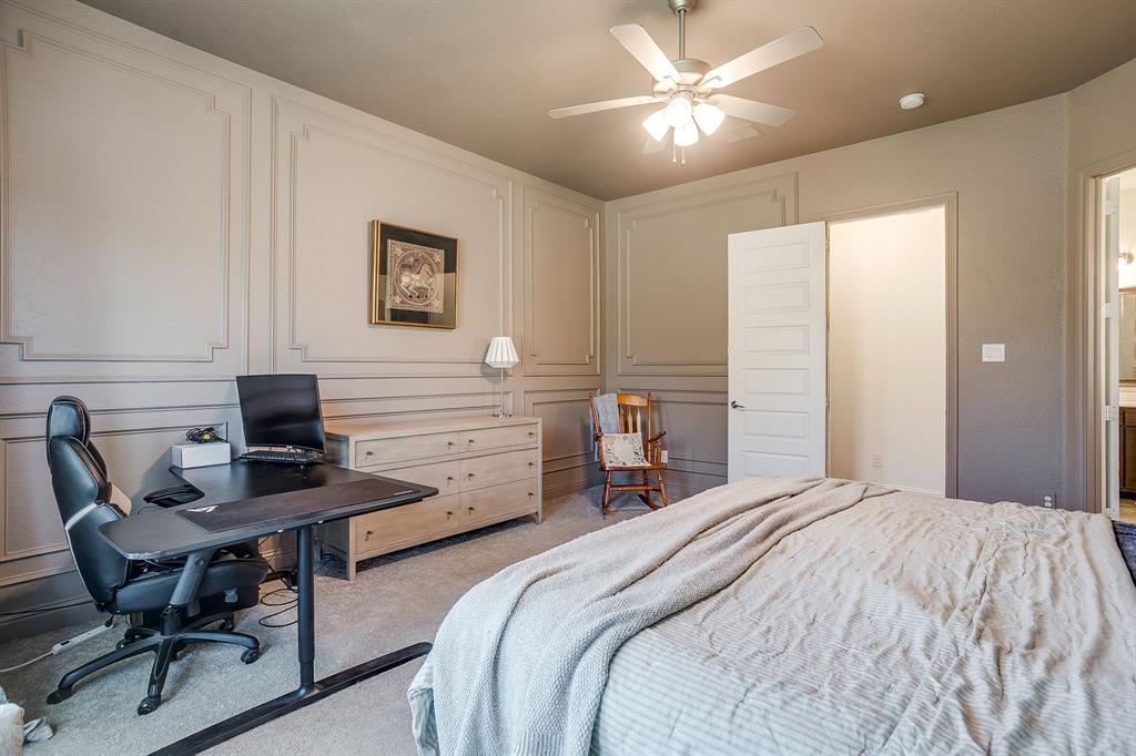 3929 Brookdale Road Benbrook, TX 76116 - Photo 23 of 39 a bedroom that has a bed and a desk in it