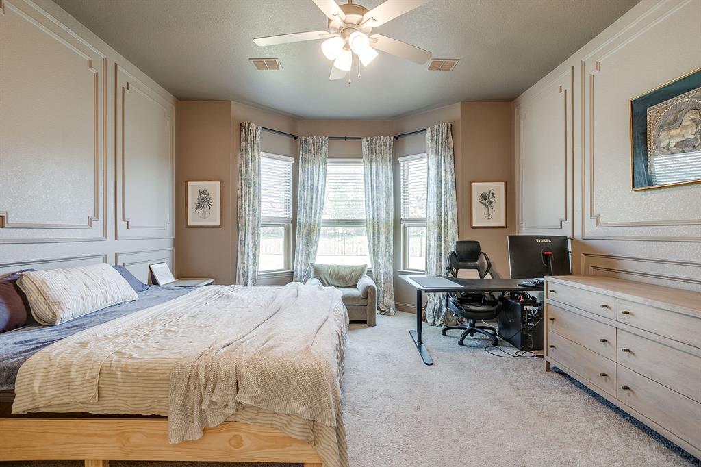 3929 Brookdale Road Benbrook, TX 76116 - Photo 24 of 39 a bedroom with a large bed and furniture