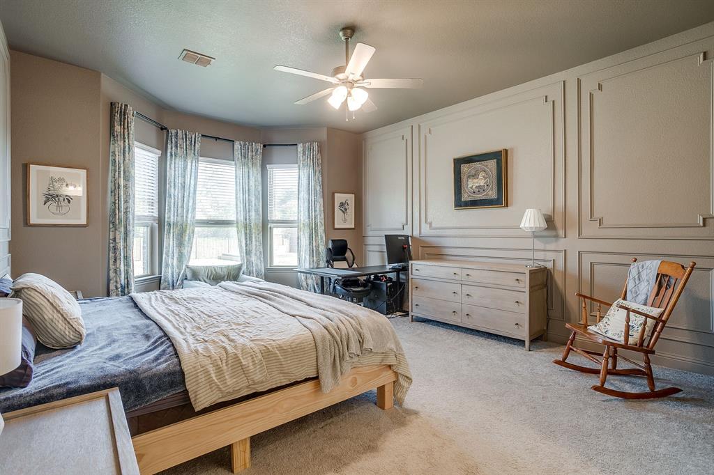 3929 Brookdale Road Benbrook, TX 76116 - Photo 25 of 39 a bed room with a bed and a chair