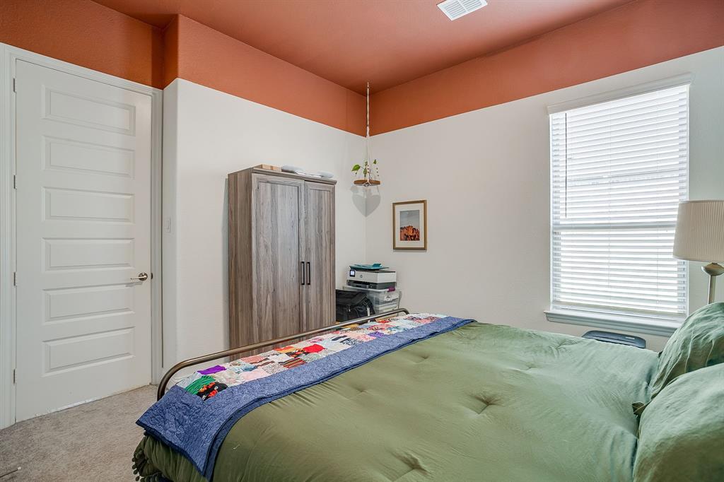 3929 Brookdale Road Benbrook, TX 76116 - Photo 32 of 39 a bedroom with a bed and a window