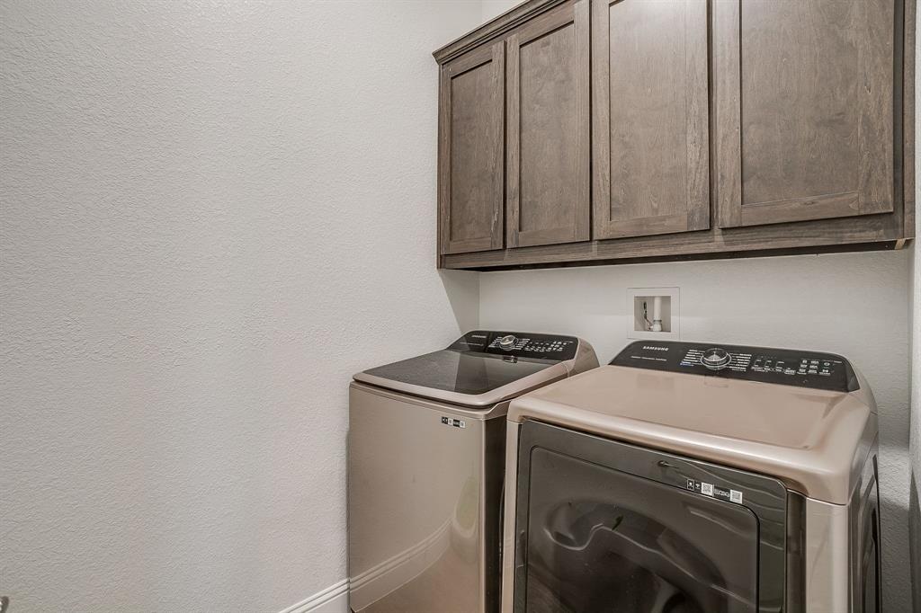 3929 Brookdale Road Benbrook, TX 76116 - Photo 35 of 39 a utility room with dryer and washer