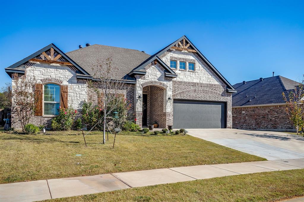 3929 Brookdale Road Benbrook, TX 76116 - Photo 5 of 39 a front view of a house with a yard