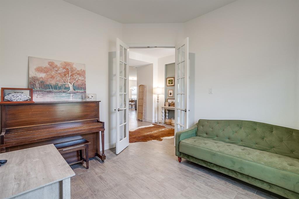 3929 Brookdale Road Benbrook, TX 76116 - Photo 9 of 39 a living room with furniture and a piano