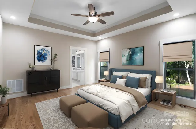 a bedroom with a large bed and a chandelier