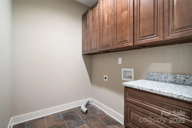 a bathroom with a sink and cabinets