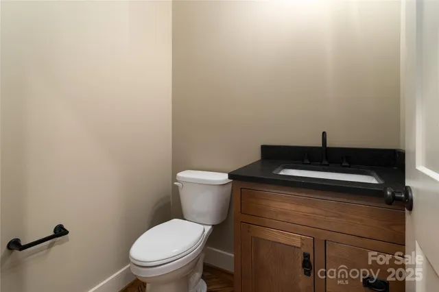 a bathroom with a toilet and a sink