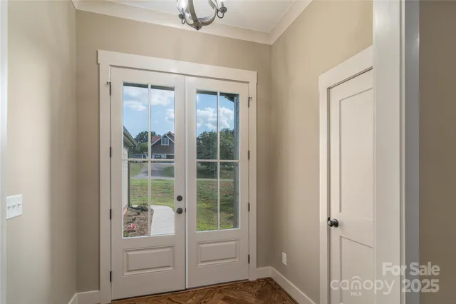 a view of front door and bedroom