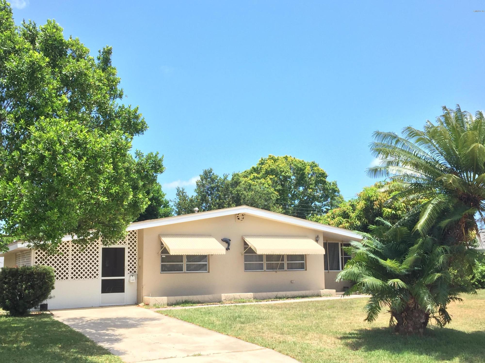 2402 Allan Adale Road Melbourne, FL 32935 - Photo 1 of 23 a view of a house with a yard