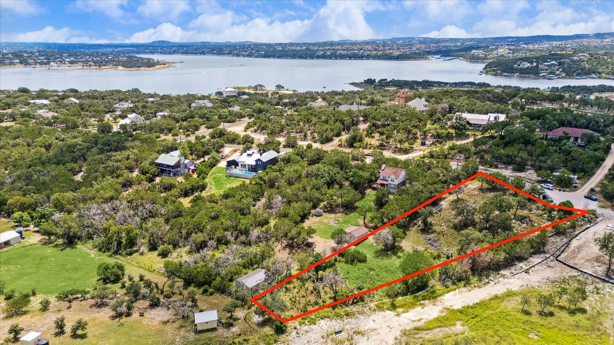 1102 Debco Lane Spicewood, TX 78669 - Photo 2 of 10 Approximate property lines. View of property location featuring property parcel outlined and a large body of water