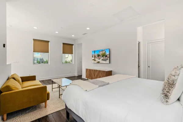 a bedroom with a bed and furniture