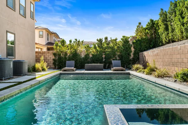 a view of a garden with a bench in a patio