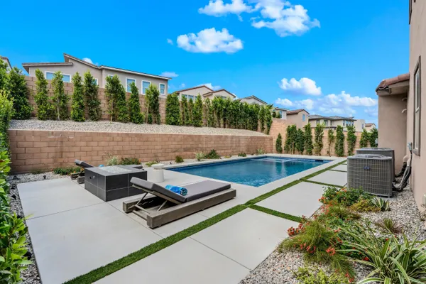 a view of a patio with a table and chairs