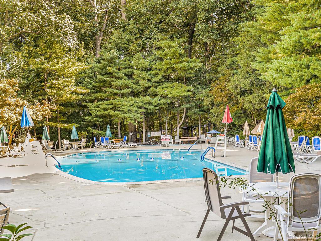 120 Dehaven Drive, Unit 629 Yonkers, NY 10703 - Photo 10 of 12 Community pool with a patio area and fence