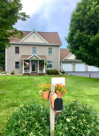 6166 Ogle Road Polo, IL 61064 - Photo 1 of 32 a front view of a house with a yard