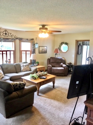 6166 Ogle Road Polo, IL 61064 - Photo 14 of 32 a living room with furniture and a window