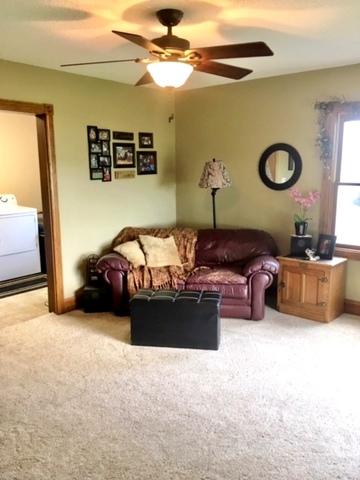6166 Ogle Road Polo, IL 61064 - Photo 16 of 32 a bedroom with furniture and a large mirror