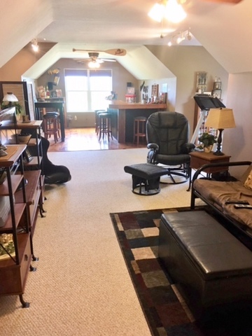 6166 Ogle Road Polo, IL 61064 - Photo 17 of 32 a living room with furniture a rug and a flat screen tv