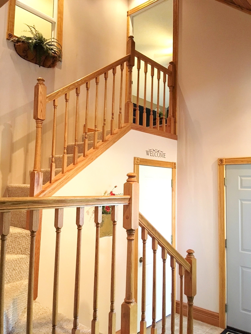 6166 Ogle Road Polo, IL 61064 - Photo 21 of 32 a view of staircase with railing and a window