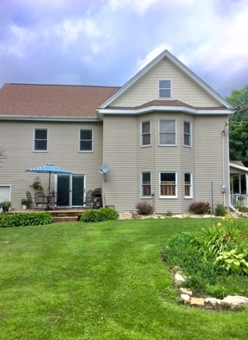 6166 Ogle Road Polo, IL 61064 - Photo 4 of 32 a front view of a house with a yard
