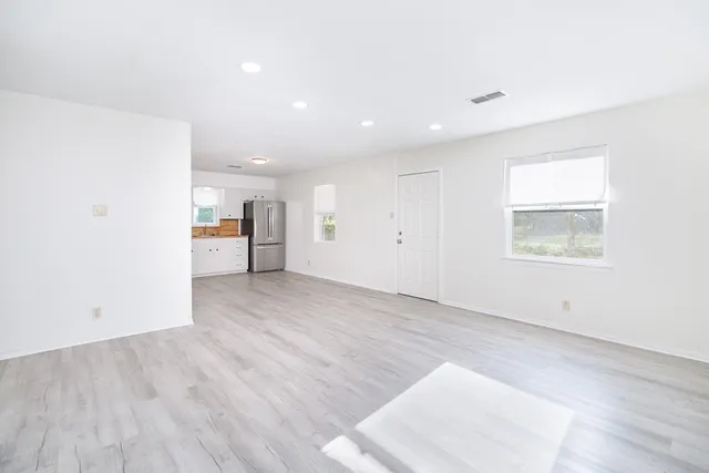 a view of a kitchen with wooden floor