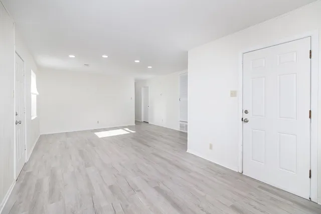a kitchen with stainless steel appliances a refrigerator and a stove top oven