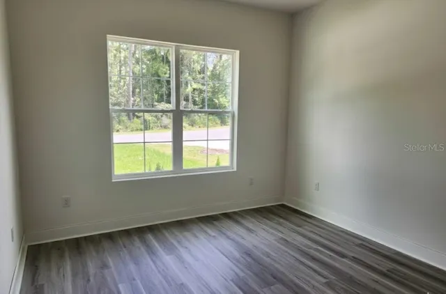 a view of wooden floor and a view of room