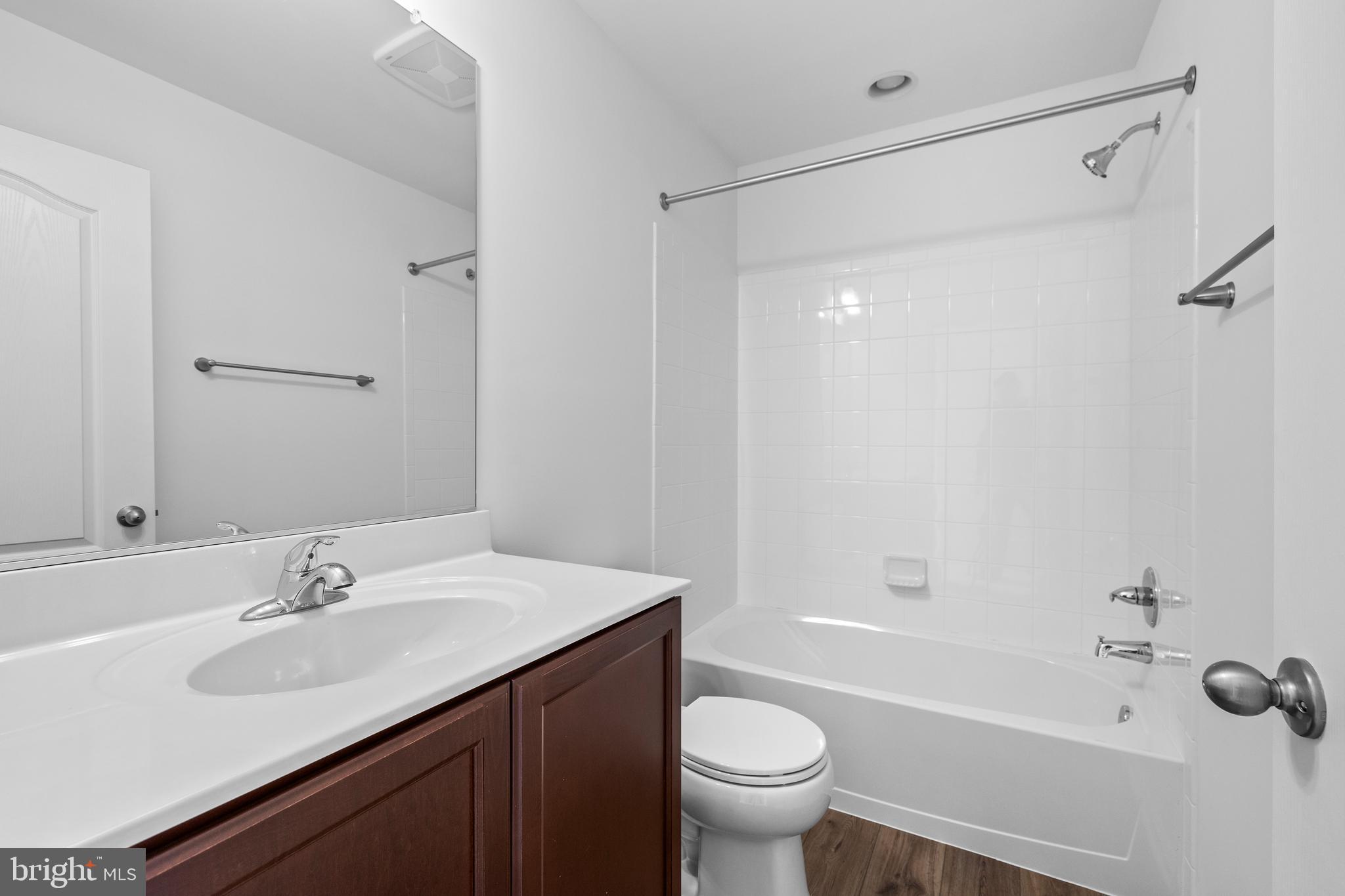 487 Peleton Street Hagerstown, MD 21740 - Photo 16 of 27 a bathroom with a sink toilet and shower