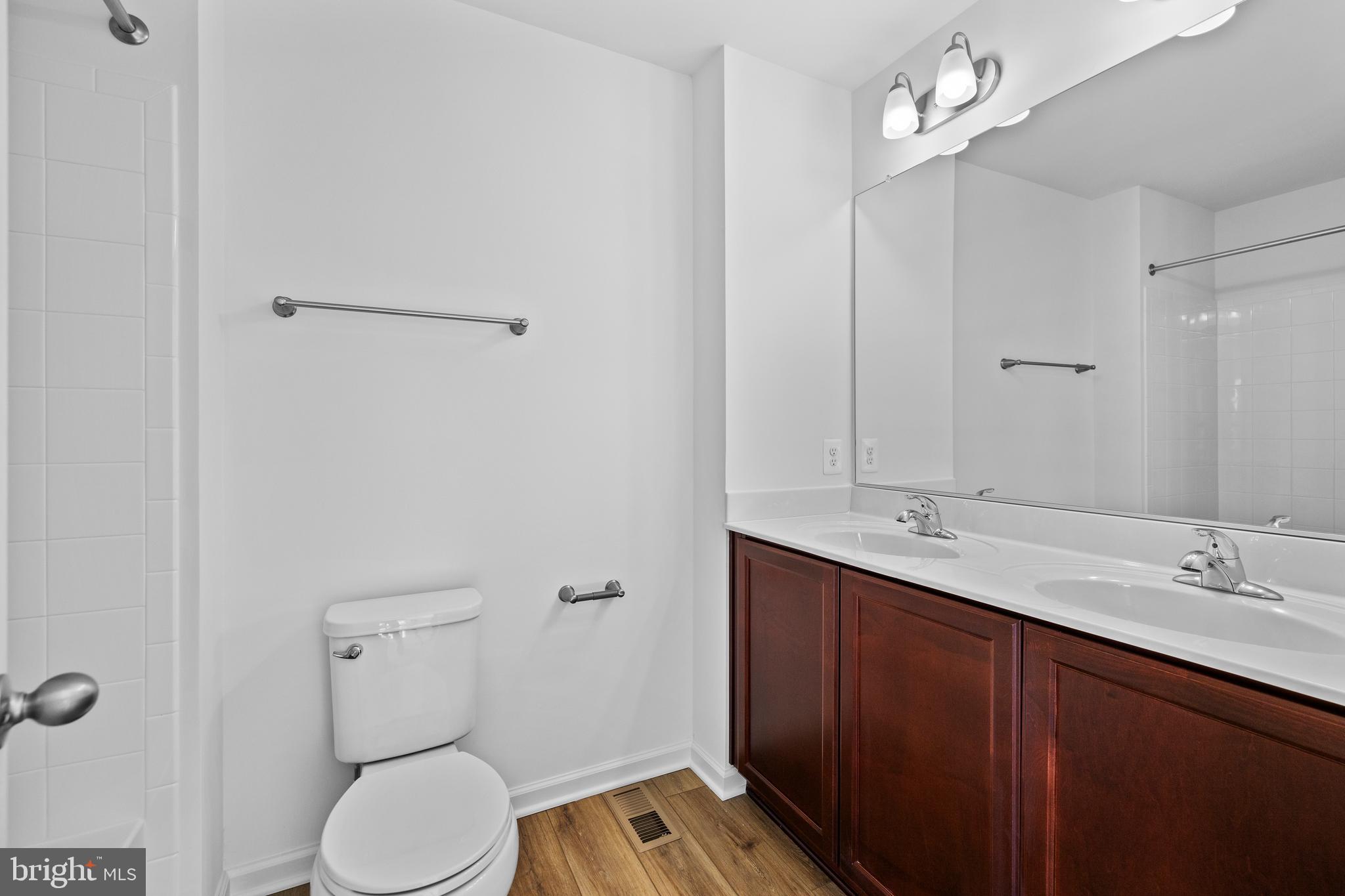 487 Peleton Street Hagerstown, MD 21740 - Photo 24 of 27 a bathroom with a toilet a sink and mirror