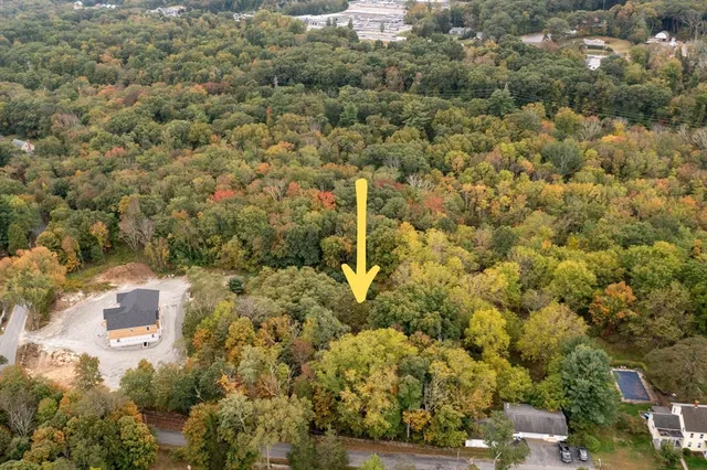 an aerial view of residential house with parking space