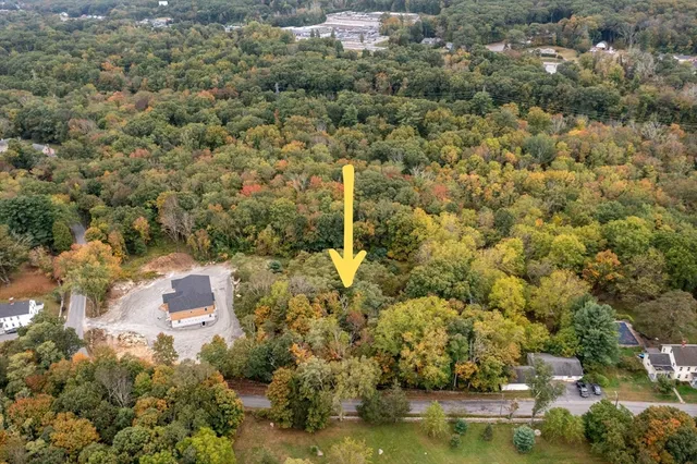 a picture of a bathroom with a white wall