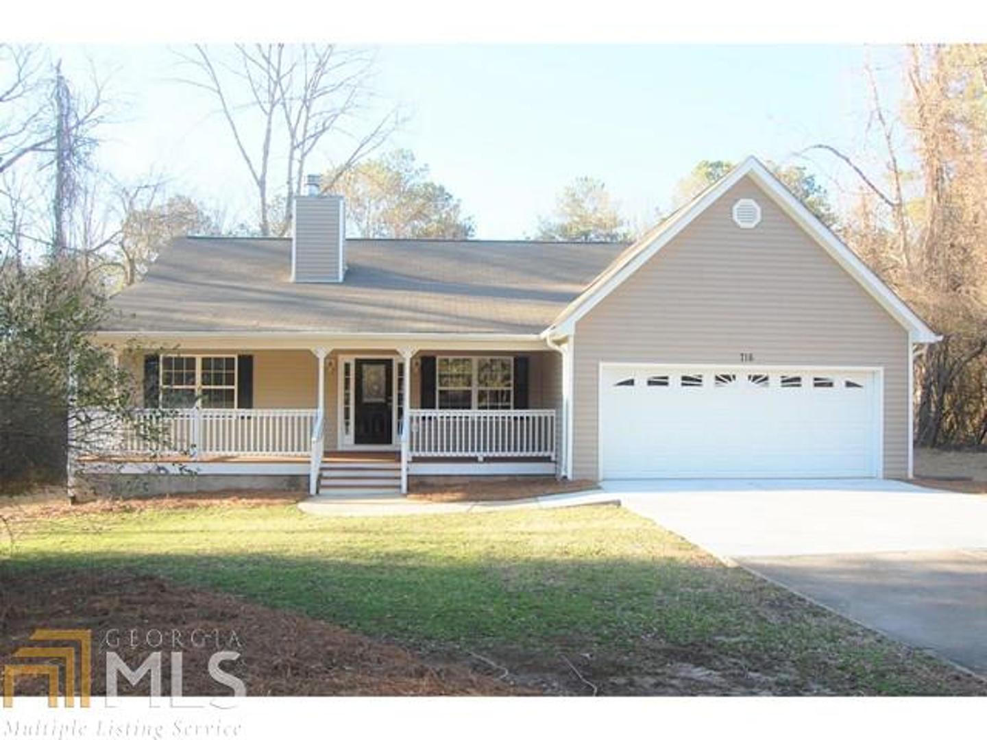 716 Barnetts Bridge Road Jackson, GA 30233 - Photo 1 of 1 a view of a house with swimming pool and a yard