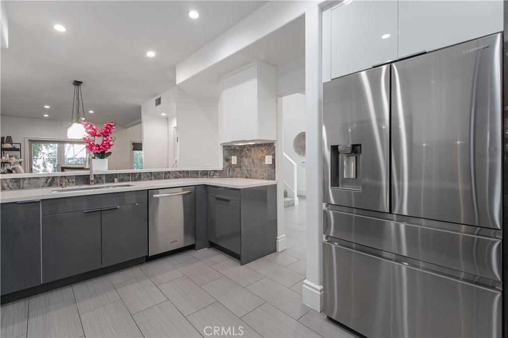 23057 Park Este Calabasas, CA 91302 - Photo 12 of 31 a kitchen with a refrigerator and sink