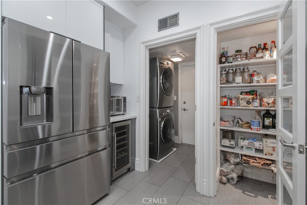 23057 Park Este Calabasas, CA 91302 - Photo 13 of 31 a metallic refrigerator freezer sitting in a kitchen