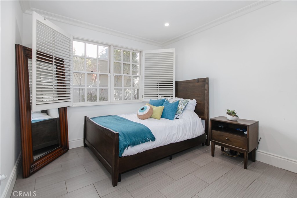 23057 Park Este Calabasas, CA 91302 - Photo 19 of 31 a bedroom with a bed and a window