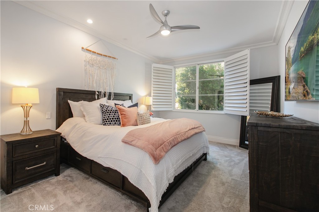 23057 Park Este Calabasas, CA 91302 - Photo 23 of 31 a bedroom with a bed and a large window