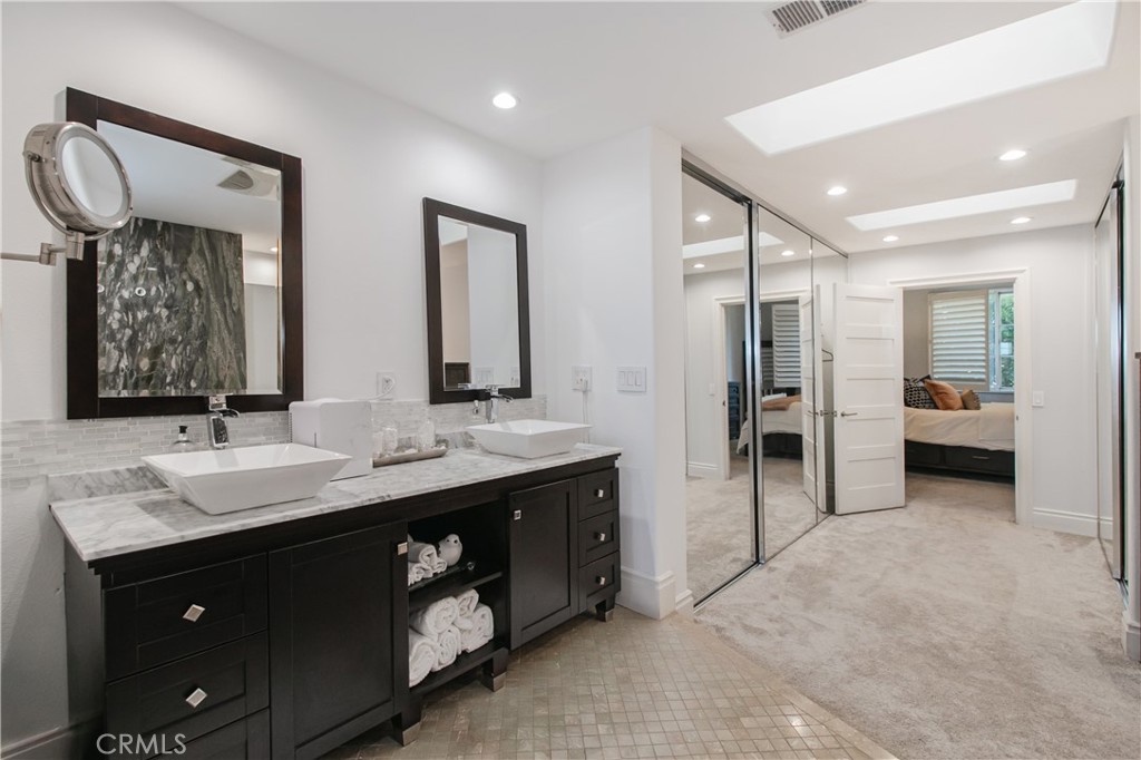 23057 Park Este Calabasas, CA 91302 - Photo 25 of 31 a spacious bathroom with a double vanity sink mirror and double
