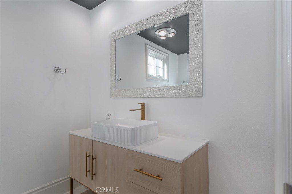 23057 Park Este Calabasas, CA 91302 - Photo 29 of 31 a bathroom with a sink and a mirror