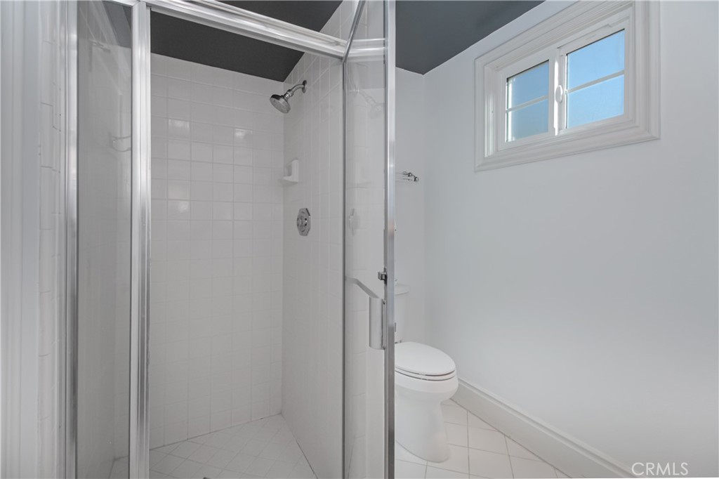 23057 Park Este Calabasas, CA 91302 - Photo 30 of 31 a bathroom with a granite countertop toilet and a shower